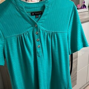 A teal blouse